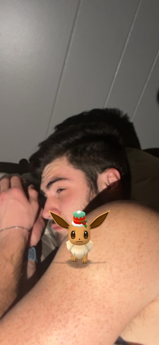 Matt Kahler asleep while a Pokemon GO Eevee stands guard on his shoulder